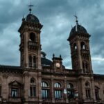 a large building with two towers and a clock