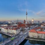 a view of a city with a bridge in the foreground