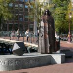 a statue of a man holding a gun